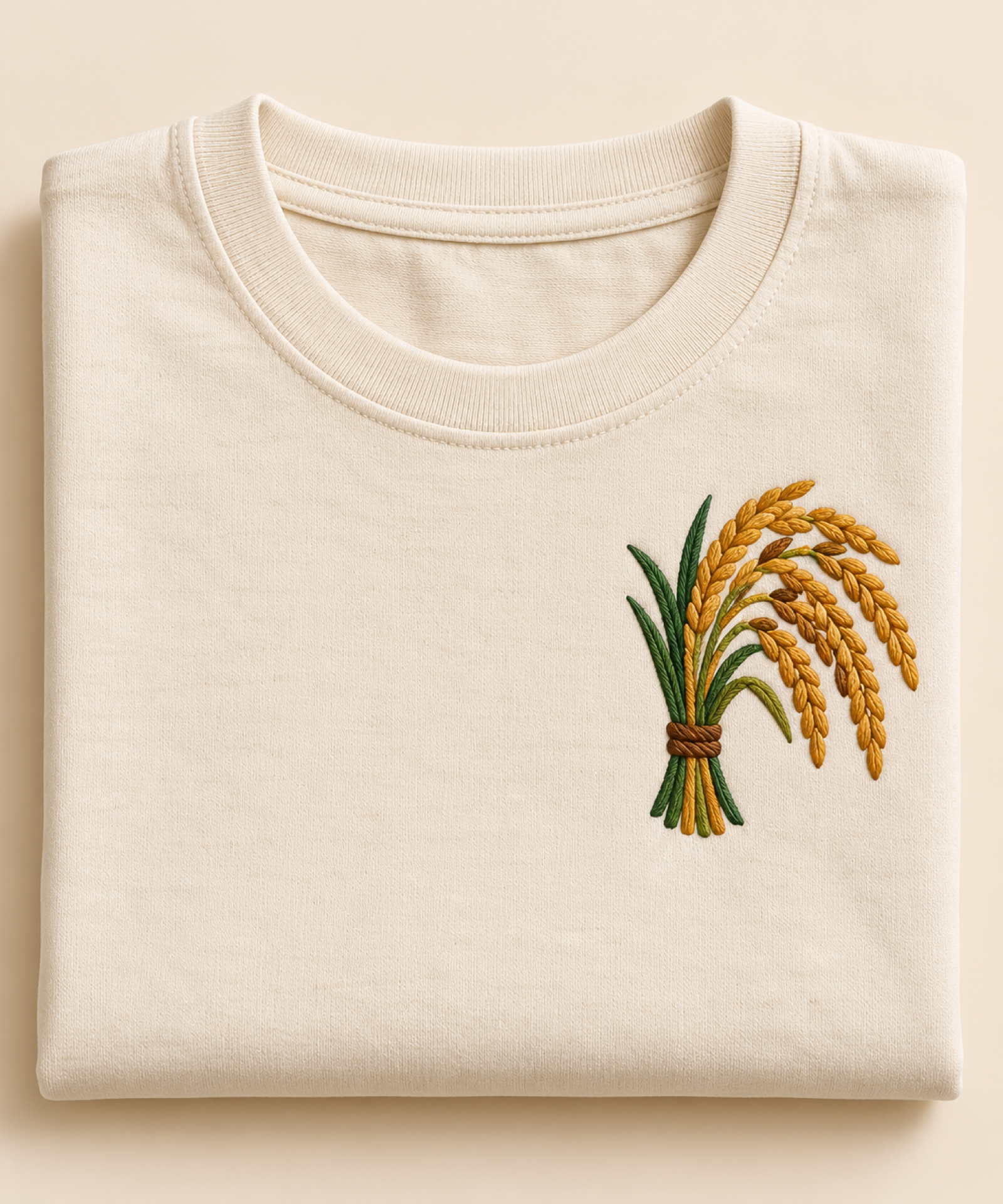 Machine-embroidered paddy rice sheaf on a t-shirt, Chhattisgarh