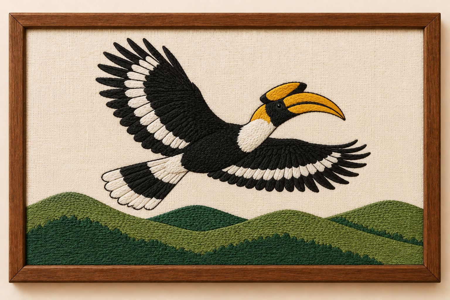 Machine-embroidered Great Indian Hornbill in flight over Naga hills