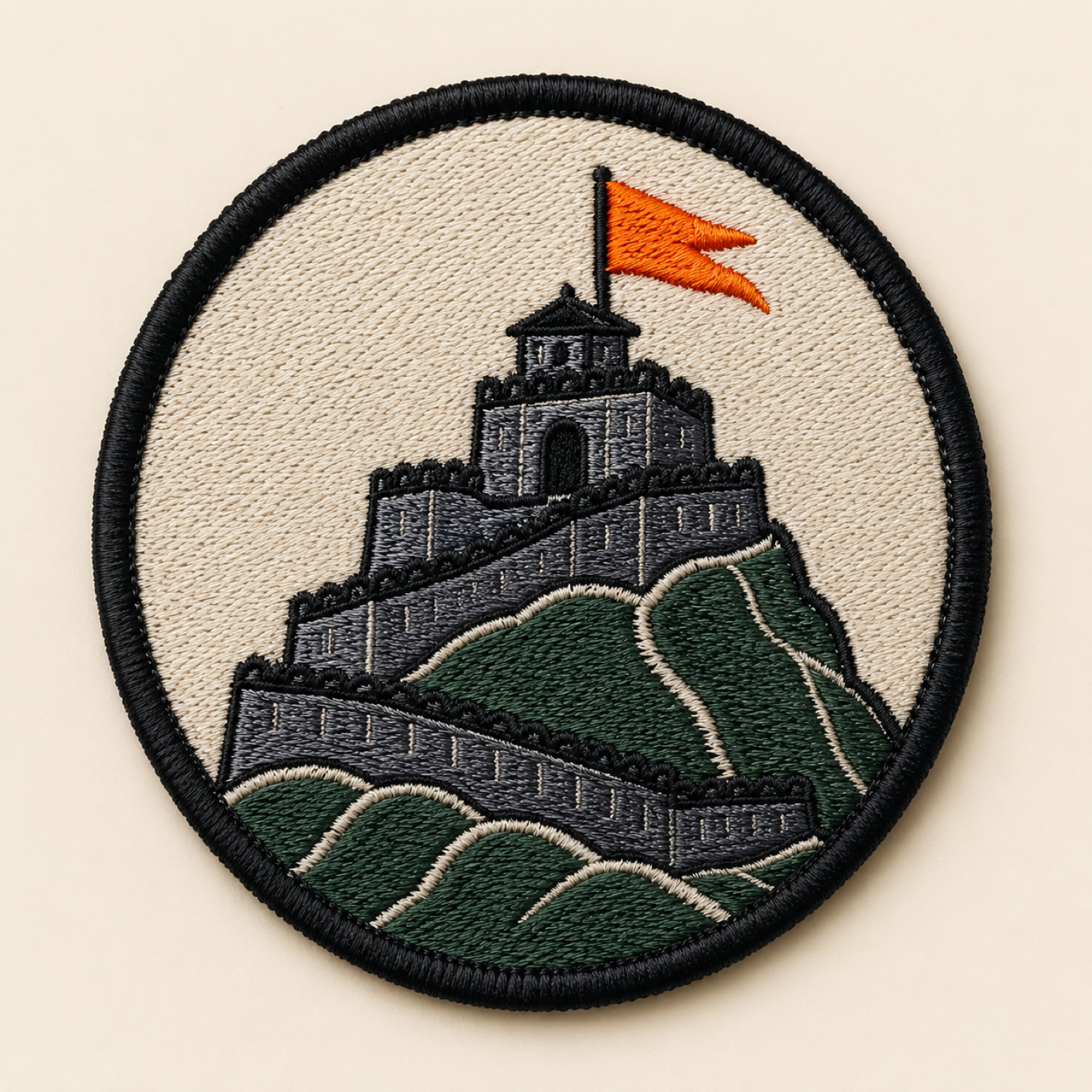 Round embroidered Raigad Fort patch with a black merrow border