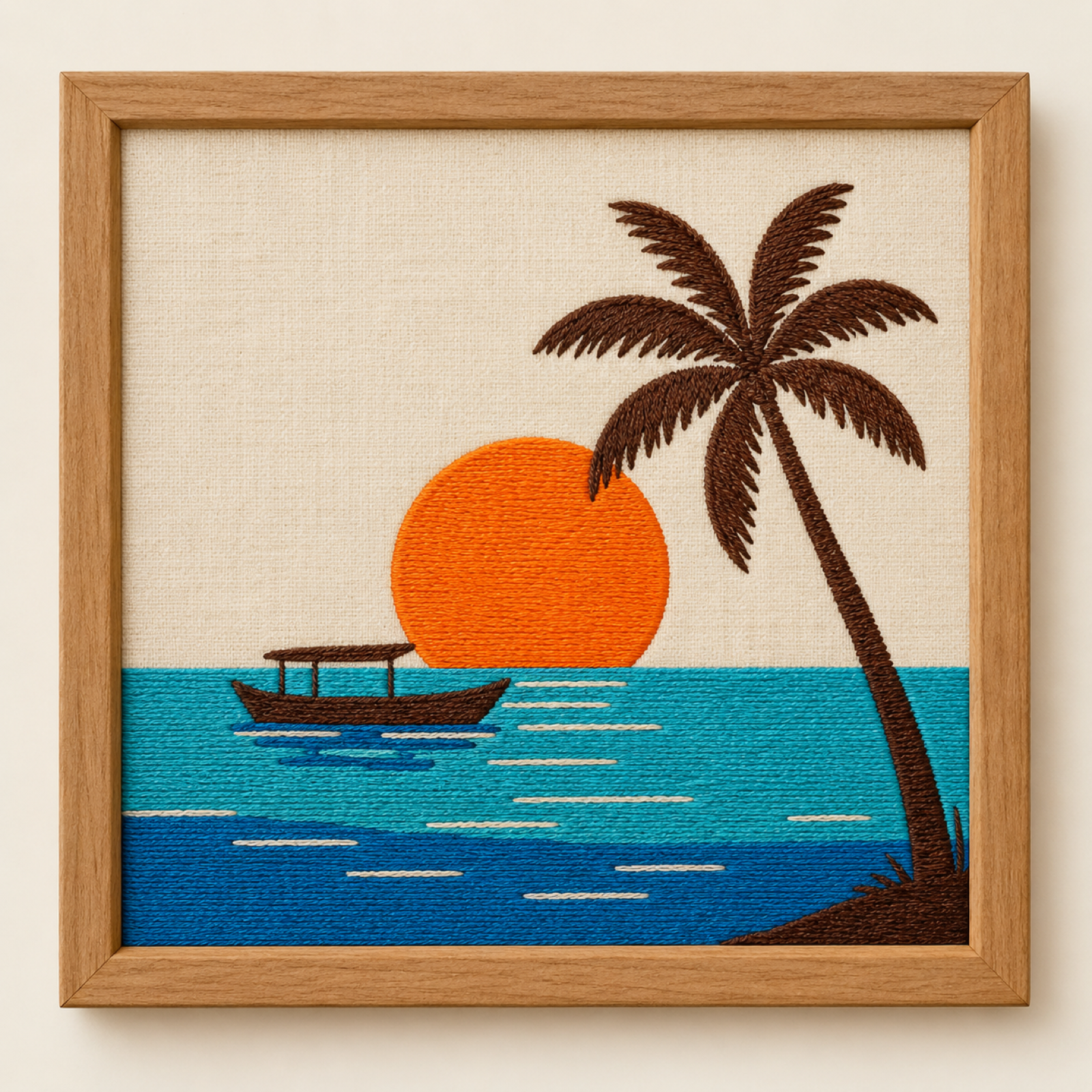 Machine-embroidered tropical island sunset with palm and boat, framed panel