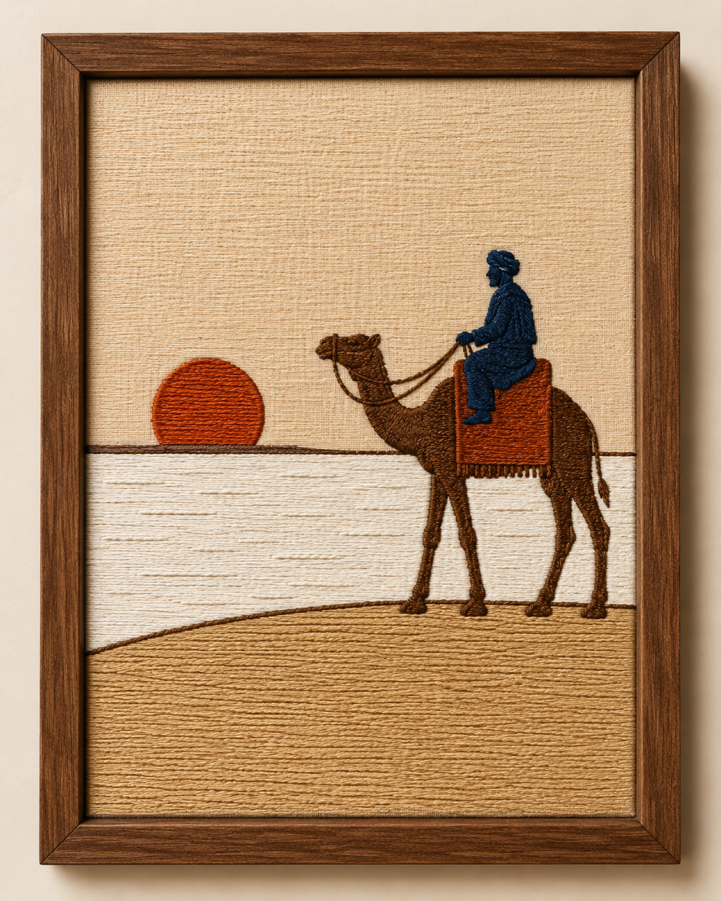 Framed embroidered Rann of Kutch scene with a camel rider and salt desert